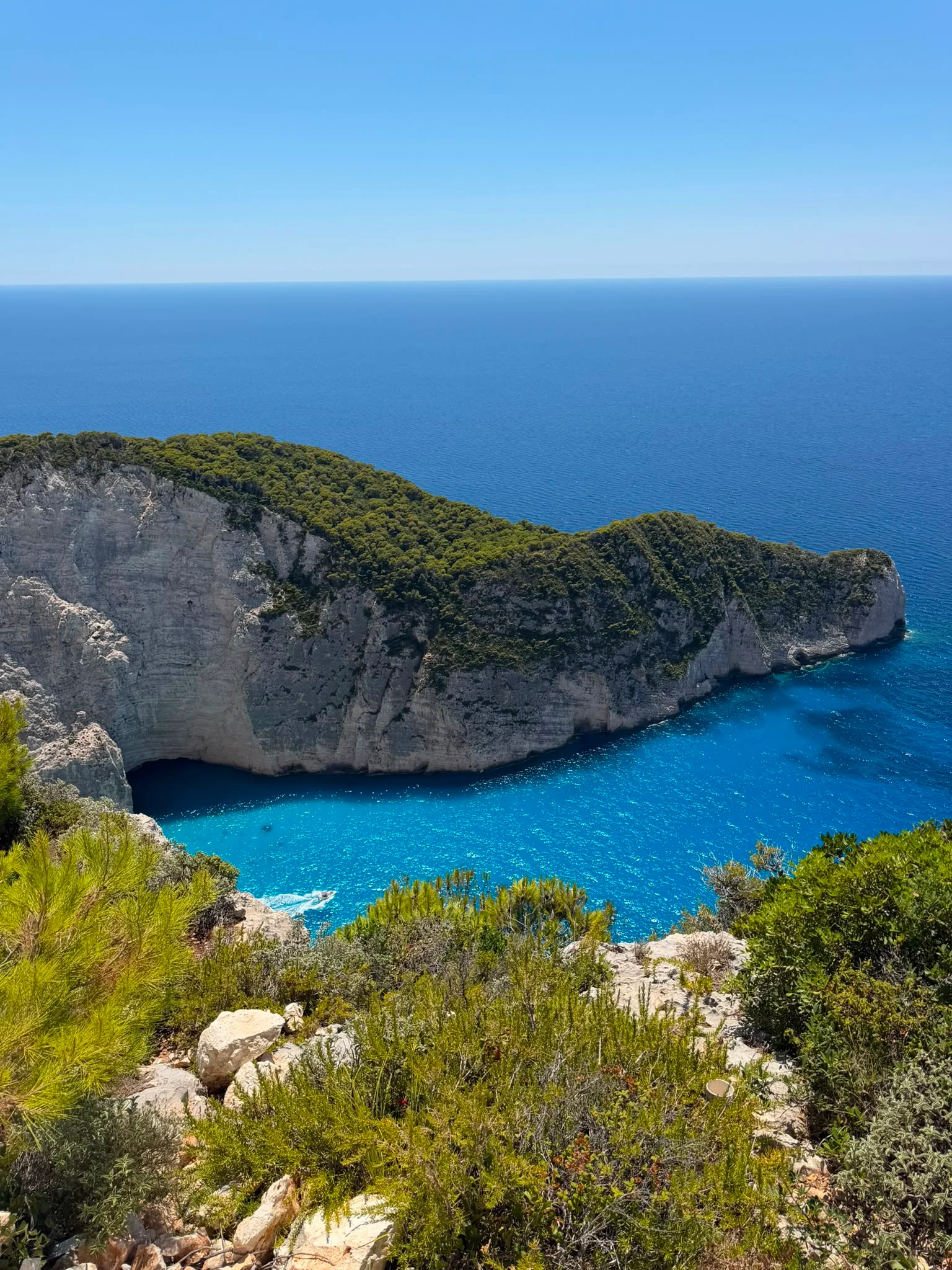 Turquoise cove framed by white cliffs on the Zakynthos coast