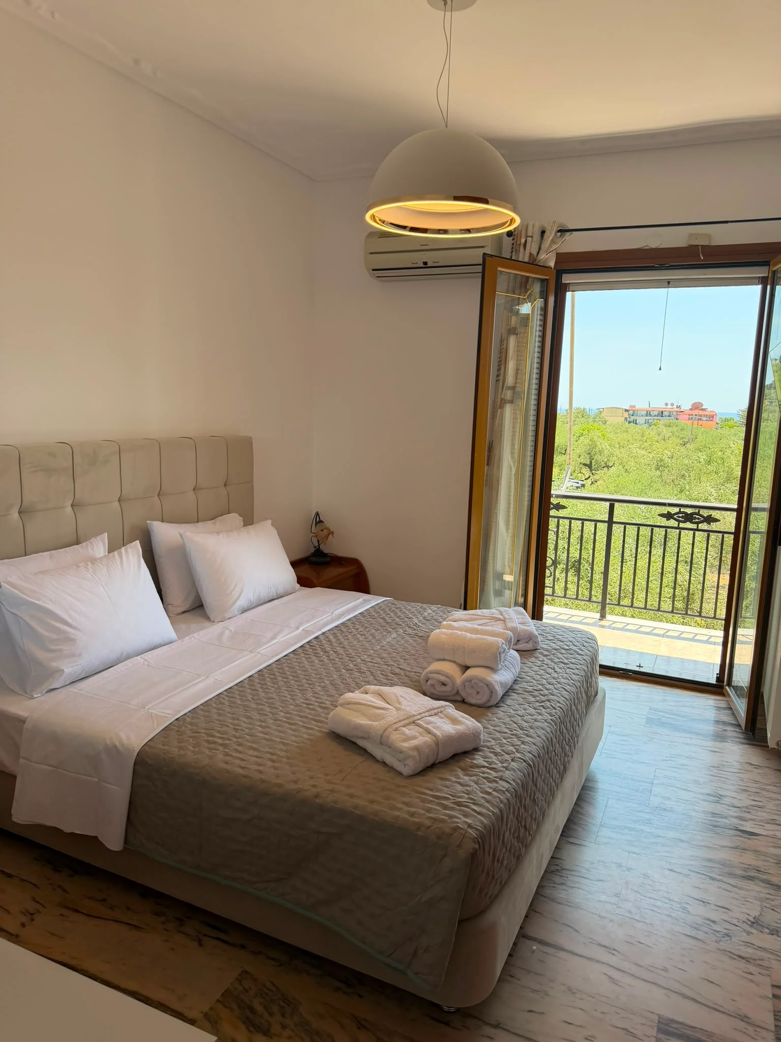 Second double bedroom with patio doors onto the balcony