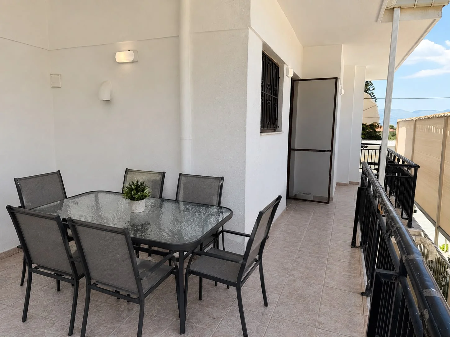 Patio area with patio door *staged photo table and chairs may be different to the photo