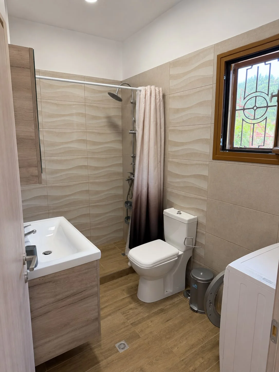 Modern family bathroom with washing machine